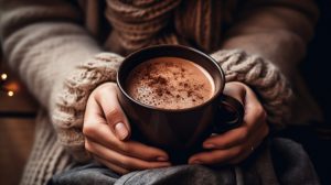 Close-Up of Hot Chocolate in Mittened Hands.