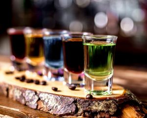side-view-multi-colored-shots-with-coffee-beans-piece-wood_141793-5025